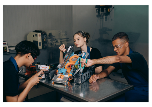 3 students working collaboratively on a robotics project