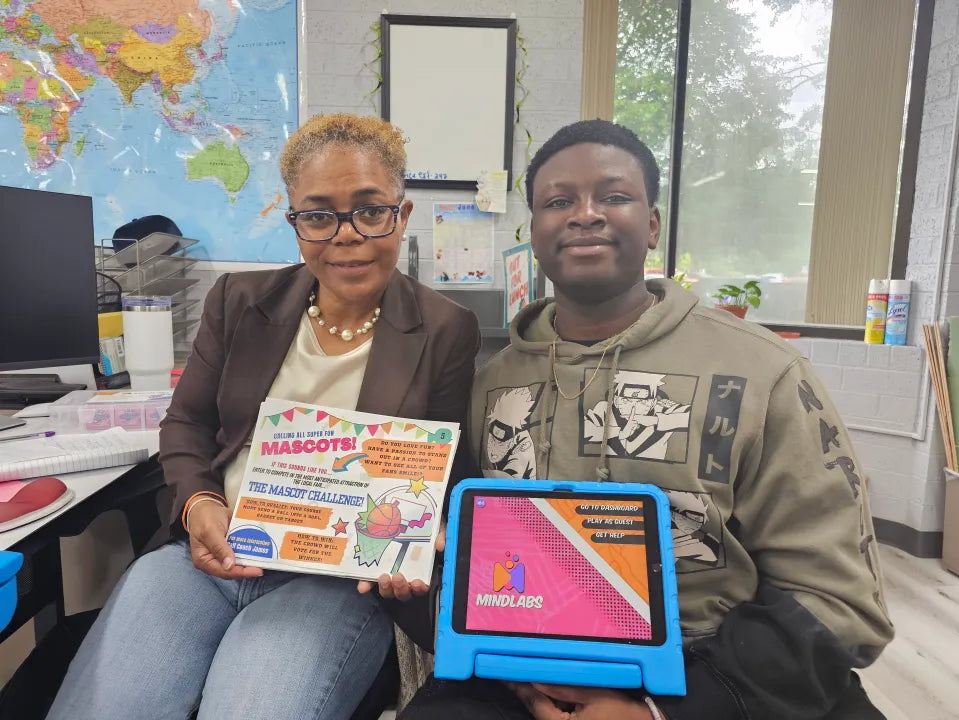 Le’Vetta Parker and Temitayo Babatunde sit together during a summer camp session about force in motion