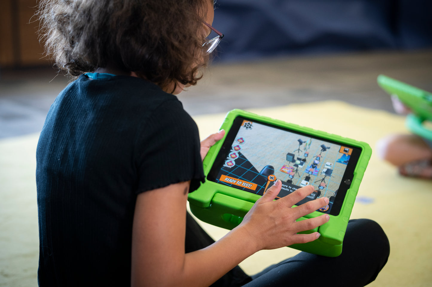 A student using a tablet to learn STEM concepts