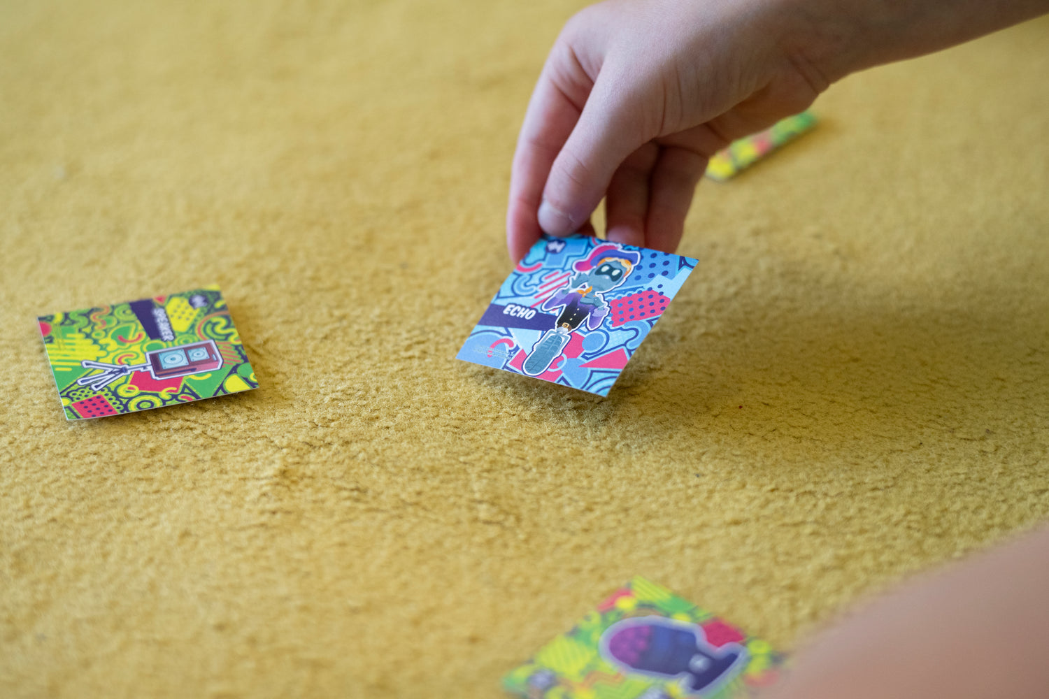 A close up picture of the MindLabs character cards used to scan into the app with a tablet