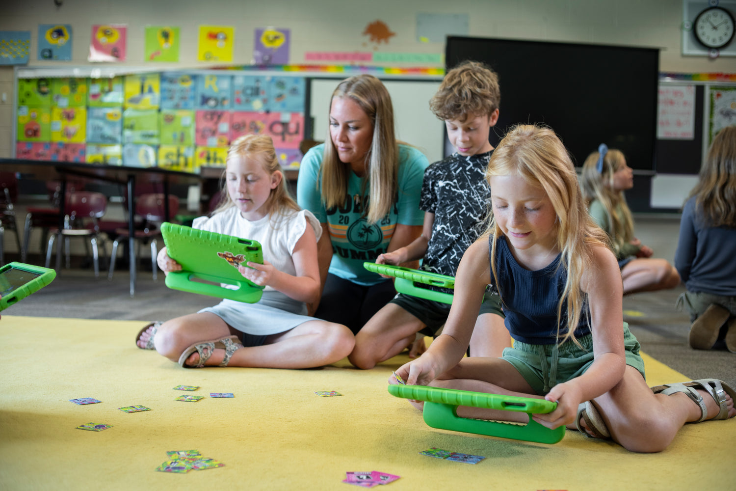 A group of students and an educator learning STEM concepts on tablets using MindLabs